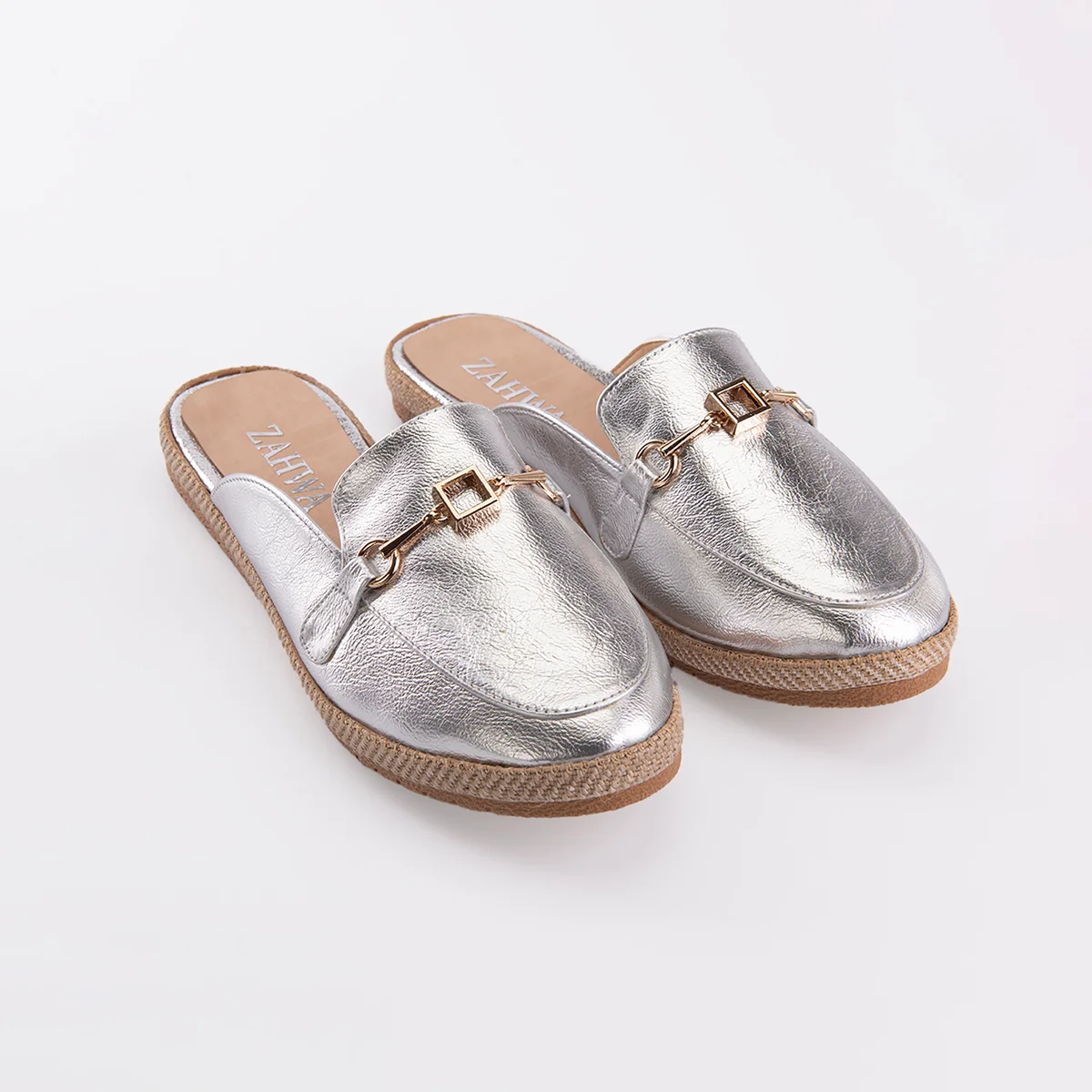 Silver metallic flat mule for women featuring elegant horsebit hardware and a comfortable slip-on design